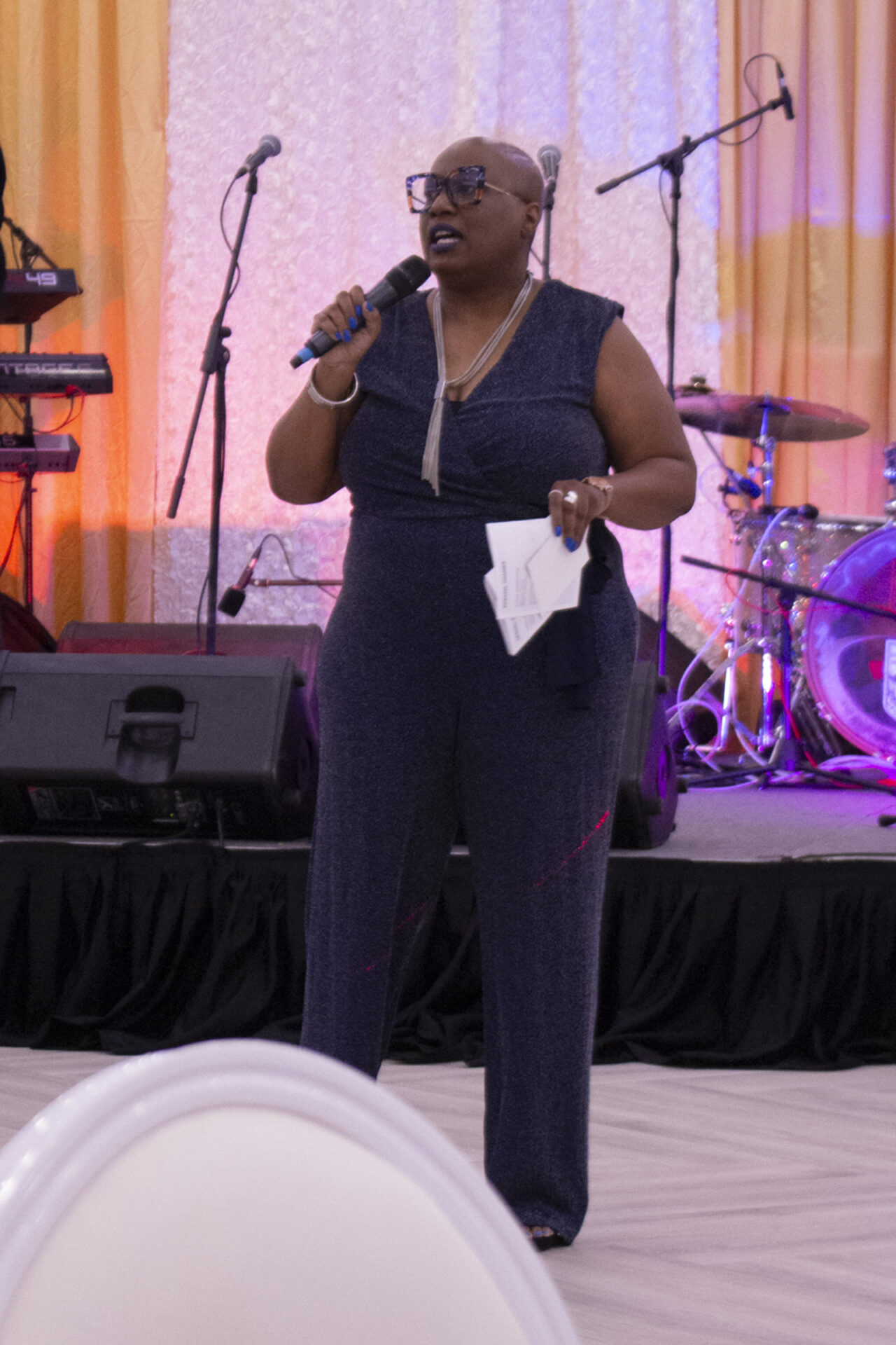 Host Danae Peart, giving remarks at the centre of the gala